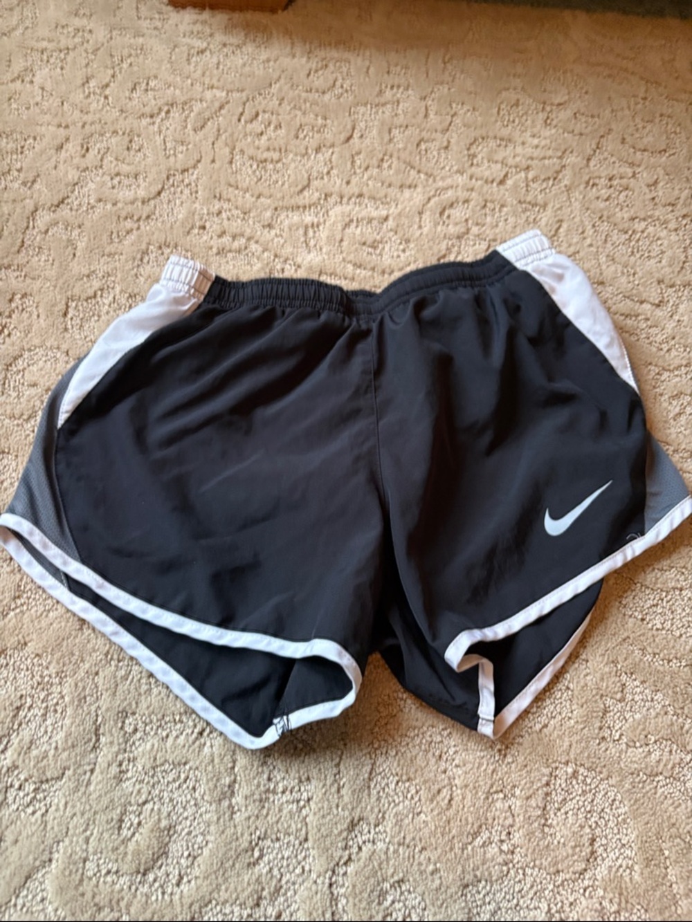 Nike Women’s Black Athletic Shorts with White Trim and Swoosh